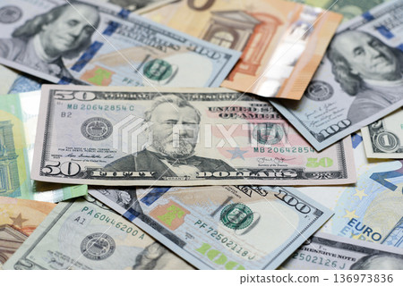Euro and dollar banknotes, exchange, sales, economic tariffs and taxes. Euros and dollars 136973836