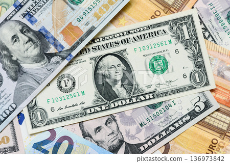 Euro and dollar banknotes, exchange, sales, economic tariffs and taxes. Euros and dollars Euro and dollar banknotes, exchange, sales, economic tariffs and taxes. Euros and dollars 136973842