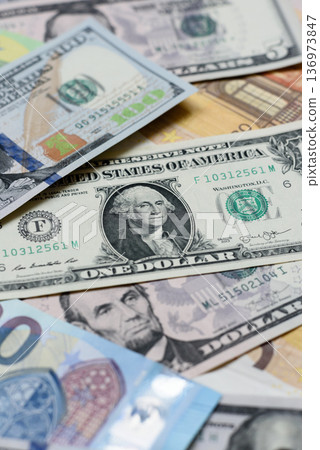 Euro and dollar banknotes, exchange, sales, economic tariffs and taxes. Euros and dollars Euro and dollar banknotes, exchange, sales, economic tariffs and taxes. Euros and dollars 136973847