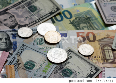 Euro and dollar banknotes, exchange, sales, economic tariffs and taxes. Euros and dollars Euro and dollar banknotes, exchange, sales, economic tariffs and taxes. Euros and dollars 136973854