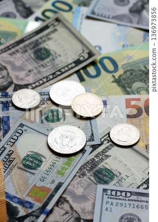 Euro and dollar banknotes, exchange, sales, economic tariffs and taxes. Euros and dollars Euro and dollar banknotes, exchange, sales, economic tariffs and taxes. Euros and dollars 136973856