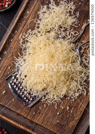 Grated Parmesan cheese as a cooking or baking ingredient. Grated Parmesan cheese Grated Parmesan cheese as a cooking or baking ingredient. Grated Parmesan cheese 136974000