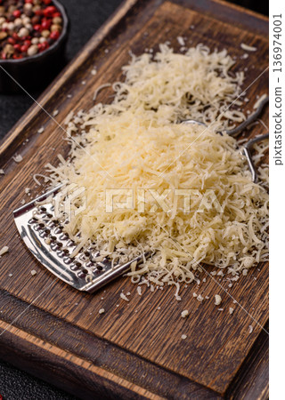 Grated Parmesan cheese as a cooking or baking ingredient. Grated Parmesan cheese Grated Parmesan cheese as a cooking or baking ingredient. Grated Parmesan cheese 136974001