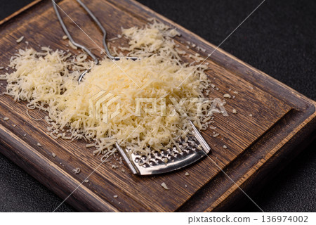 Grated Parmesan cheese as a cooking or baking ingredient. Grated Parmesan cheese 136974002
