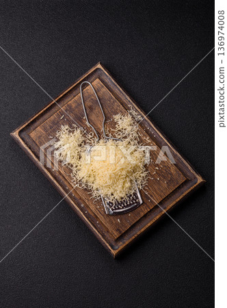 Grated Parmesan cheese as a cooking or baking ingredient. Grated Parmesan cheese Grated Parmesan cheese as a cooking or baking ingredient. Grated Parmesan cheese 136974008