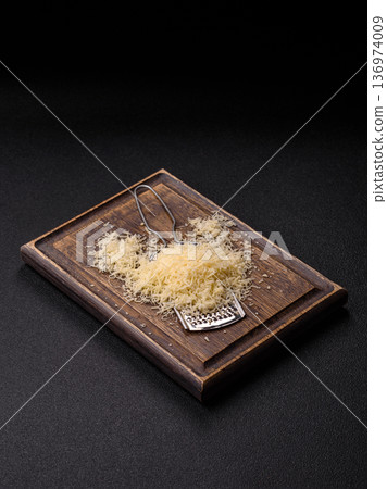 Grated Parmesan cheese as a cooking or baking ingredient. Grated Parmesan cheese 136974009