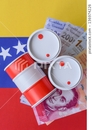 Metal barrels of oil, gas, or chemicals on the Venezuelan flag, Venezuela production. Barrels of oil Metal barrels of oil, gas, or chemicals on the Venezuelan flag, Venezuela production. Barrels of oil 136974226