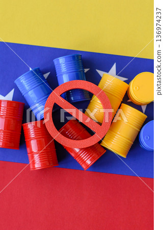 Barrels of oil, gas, or chemicals on the venezuelan flag and a ban sign. Barrels of venezuela oil 136974237