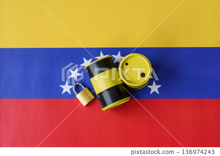 Barrels of oil, gas, or chemicals on the venezuelan flag and a ban sign. Barrels of venezuela oil 136974243