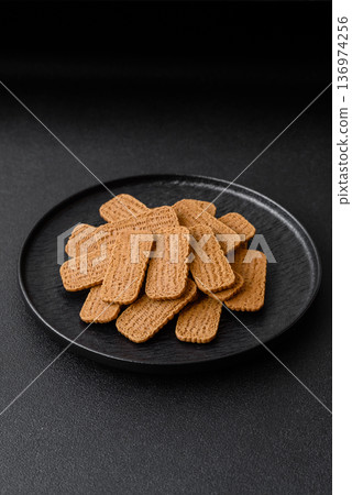Caramel biscuit cookies, or shortbread, are a healthy breakfast food. Biscuit cookies Caramel biscuit cookies, or shortbread, are a healthy breakfast food. Biscuit cookies 136974256