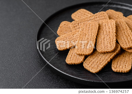 Caramel biscuit cookies, or shortbread, are a healthy breakfast food. Biscuit cookies Caramel biscuit cookies, or shortbread, are a healthy breakfast food. Biscuit cookies 136974257