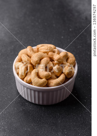 Roasted or raw cashew make a savory snack for a healthy, filling meal. Cashew nuts 136974297