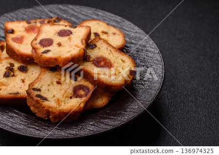 Fruit cake, a dessert with cherries, plums, and raisins for a festive Christmas table. Fruit cake 136974325