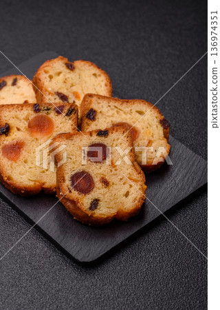 Fruit cake, a dessert with cherries, plums, and raisins for a festive Christmas table. Fruit cake 136974351