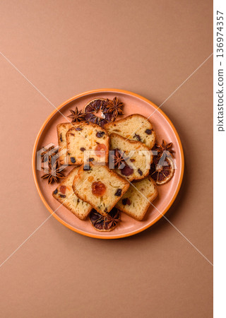 Fruit cake, a dessert with cherries, plums, and raisins for a festive Christmas table. Fruit cake 136974357