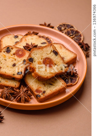 Fruit cake, a dessert with cherries, plums, and raisins for a festive Christmas table. Fruit cake 136974366