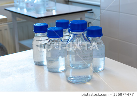 Laboratory glass bottles with samples in incubator for microbiological testing Laboratory glass bottles with samples in incubator for microbiological testing 136974477