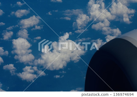 Sea of clouds seen from an airplane in midsummer 136974694