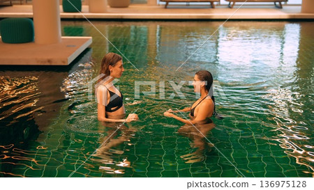 Women in warm water exchange supportive and heartfelt words Women in warm water exchange supportive and heartfelt words 136975128