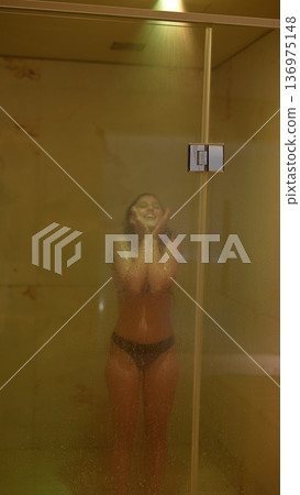 Silhouette of woman after yoga in steamy spa atmosphere 136975148