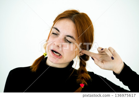 Portrait of a young woman having ear pain. Portrait of a young woman having ear pain. 136975617