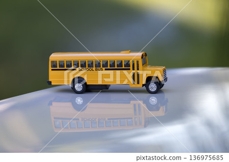 Toy american yellow school bus as symbol of education in the USA 136975685