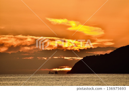 Beautiful sunset clouds over Kasado Island 136975693