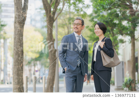 Middle-aged business person Middle-aged business person 136977131