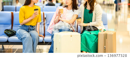 Women chatting at the airport ■Photography provided by Kansai International Airport (KIX) 136977328