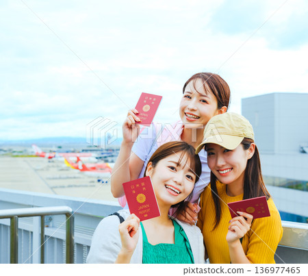 Three happy women at the airport ■ Photo courtesy of Kansai International Airport (KIX) Three happy women at the airport ■ Photo courtesy of Kansai International Airport (KIX) 136977465