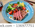 Beef tenderloin steak and red wine. 136977751