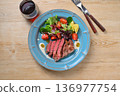 Beef tenderloin steak and red wine. 136977754