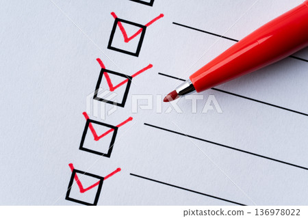 Close-up of a check box marked with a red pen Close-up of a check box marked with a red pen 136978022