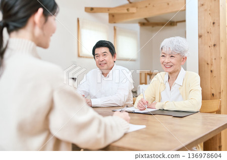 Asian family discussing their future Asian family discussing their future 136978604