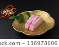 Red and white kamaboko on a plate 136978606
