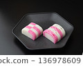 Red and white kamaboko on a plate 136978609