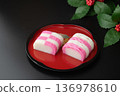 Red and white kamaboko on a plate 136978610