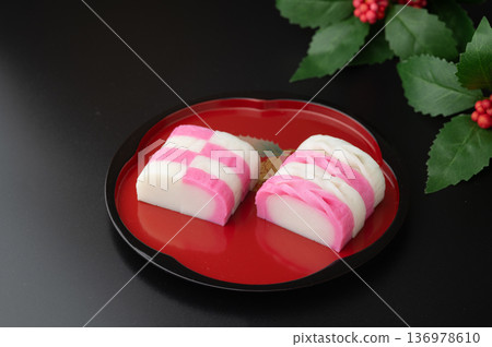 Red and white kamaboko on a plate 136978610