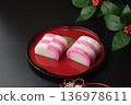 Red and white kamaboko on a plate 136978611