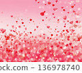 Many red, pink and white heart shapes floating from bottom to top on a pale pink background 136978740