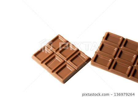 Simple composition of chocolate pieces Simple composition of chocolate pieces 136979264