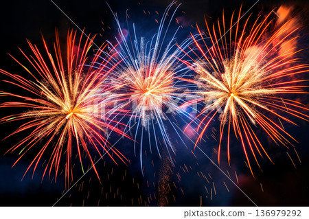 Spectacular fireworks with red and blue sparkles Spectacular fireworks with red and blue sparkles 136979292