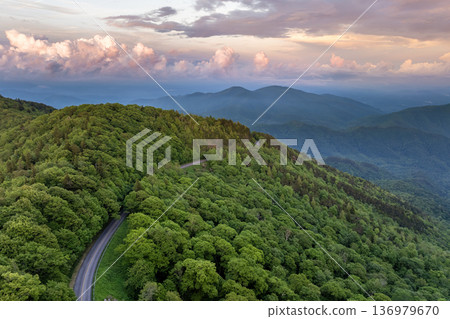 Car road trip on Blue Ridge Parkway in North Carolina Appalachian mountains in summer season at sunset. Summertime landscape of beautiful nature Car road trip on Blue Ridge Parkway in North Carolina Appalachian mountains in summer season at sunset. Summertime landscape of beautiful nature 136979670