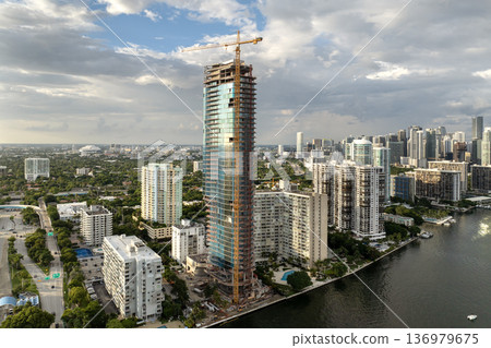 Miami, Florida. Developing American megapolis with new high-rise building under construction Miami, Florida. Developing American megapolis with new high-rise building under construction 136979675