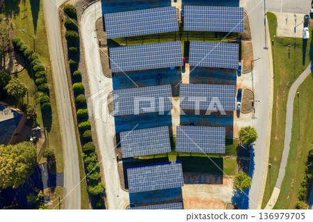 Solar canopy over car parking space in Clemson, South Carolina. Generating renewable energy and providing shade for vehicles. Solar canopy over car parking space in Clemson, South Carolina. Generating renewable energy and providing shade for vehicles. 136979705