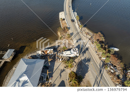Natural disaster aftermath. Destroyed yachts after hurricane Milton on Manasota Key in Englewood, Florida Natural disaster aftermath. Destroyed yachts after hurricane Milton on Manasota Key in Englewood, Florida 136979794