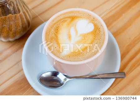 Cup of fresh cortado on table 136980744