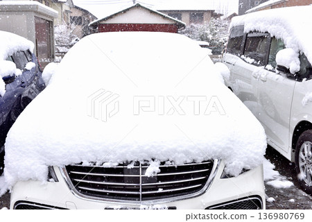 Snow falling on a passenger car Snow falling on a passenger car 136980769