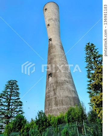A water tower against the blue sky 136981183