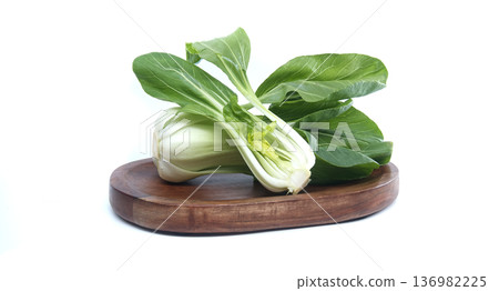 Fresh bok choy vegetable on a wooden board, healthy food ingredient for cooking 136982225